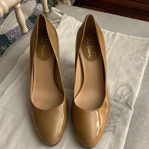 Beige patent leather Cole Haan Pumps.  Size 8B.